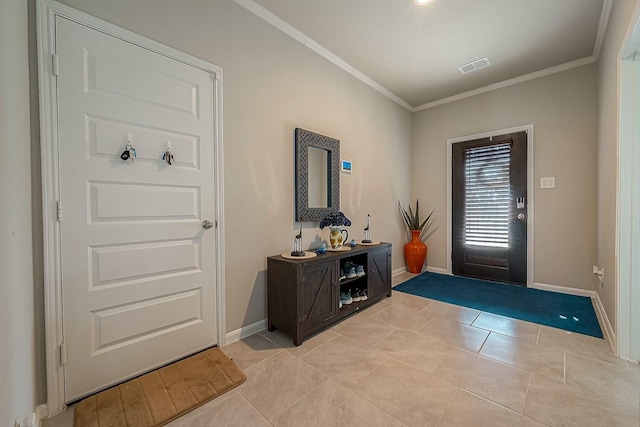 foyer entrance featuring light tile patterned floors and ornamental molding