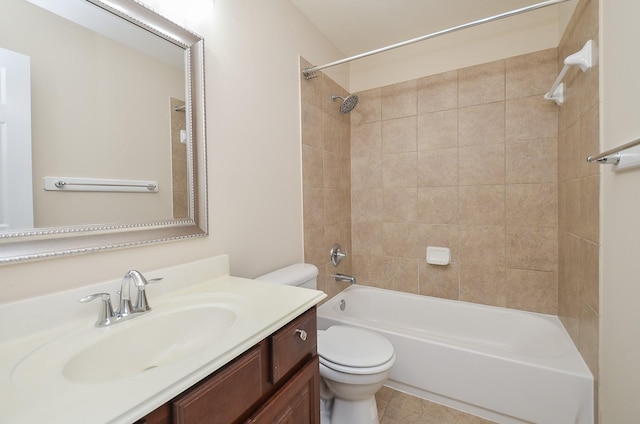 full bathroom with vanity, tiled shower / bath combo, and toilet