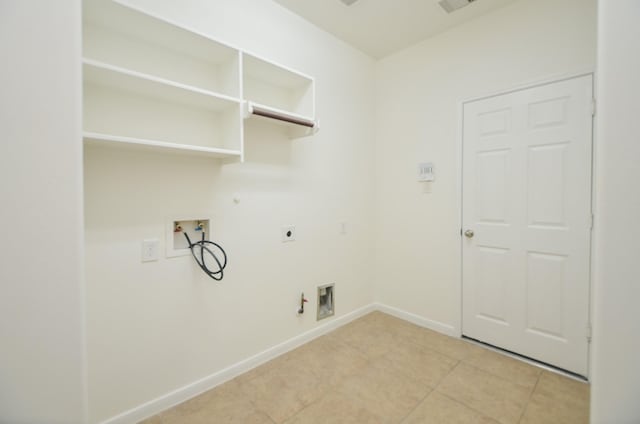 clothes washing area with laundry area, baseboards, hookup for a gas dryer, hookup for a washing machine, and hookup for an electric dryer