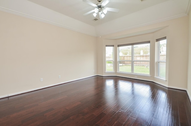 empty room with ornamental molding, dark hardwood / wood-style floors, ceiling fan, and lofted ceiling