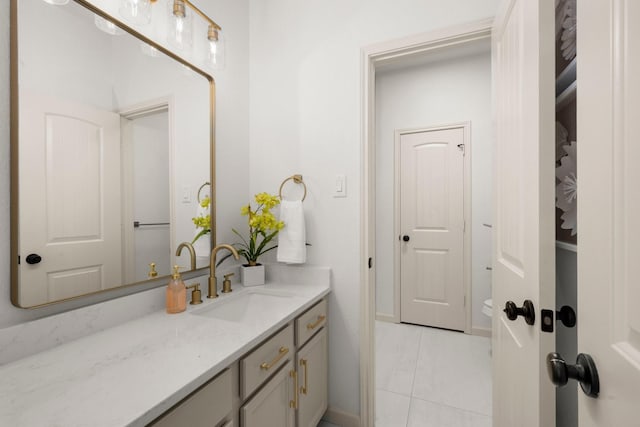 bathroom featuring tile patterned floors and vanity