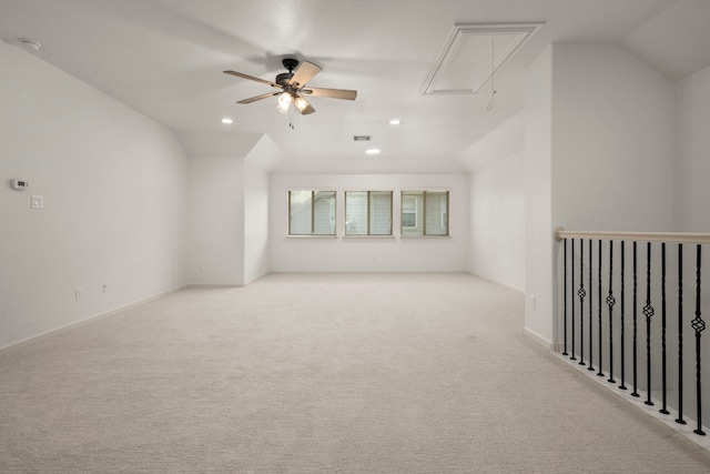 carpeted empty room featuring ceiling fan and lofted ceiling