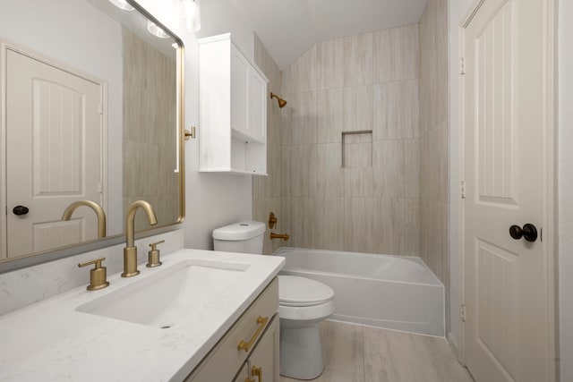 full bathroom with toilet, vanity, lofted ceiling, and tub / shower combination