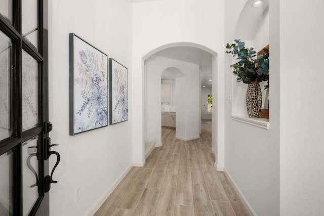 corridor featuring light hardwood / wood-style floors