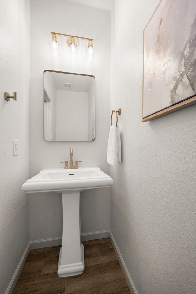 bathroom featuring hardwood / wood-style flooring