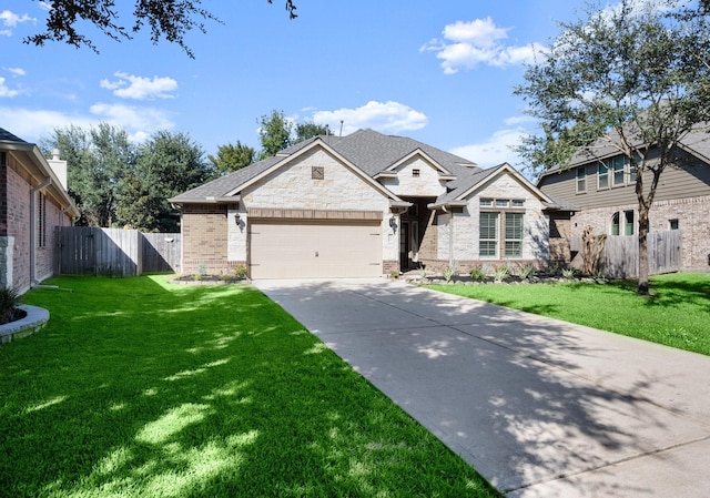 view of front of property with a front yard and a garage