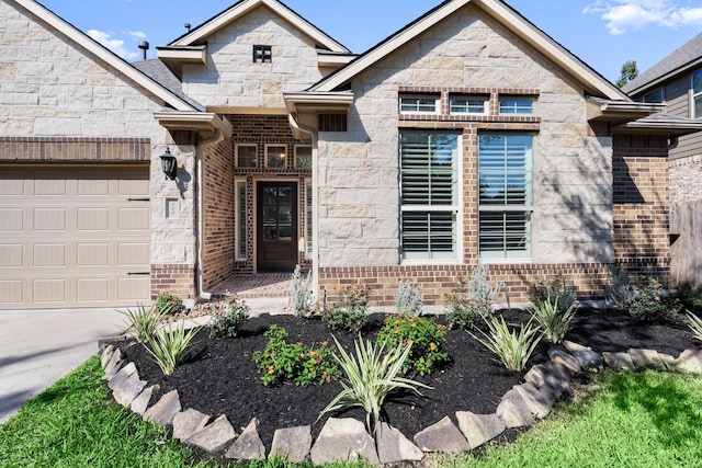 view of exterior entry with a garage