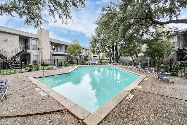 view of swimming pool with a patio