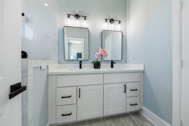 bathroom featuring hardwood / wood-style flooring and vanity