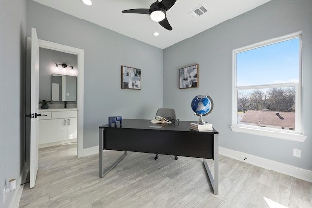 office area featuring light hardwood / wood-style floors and ceiling fan