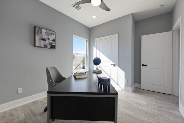 office space featuring light hardwood / wood-style floors and ceiling fan