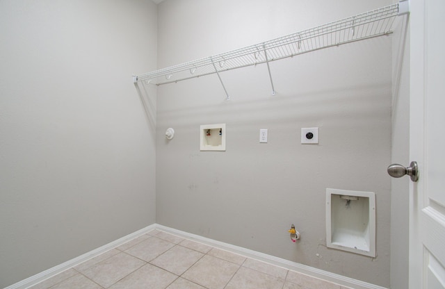 laundry area featuring washer hookup, light tile patterned floors, gas dryer hookup, and electric dryer hookup