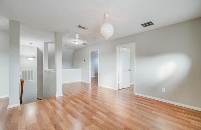 unfurnished room featuring light hardwood / wood-style floors