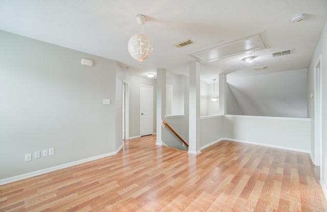 unfurnished room with light wood-type flooring