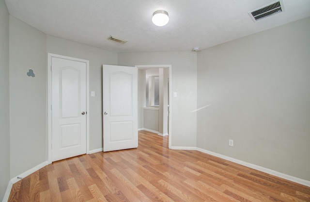 unfurnished bedroom with light hardwood / wood-style floors