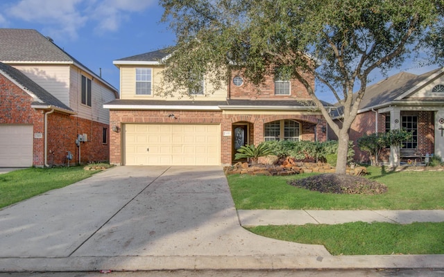 view of property featuring a garage and a front lawn