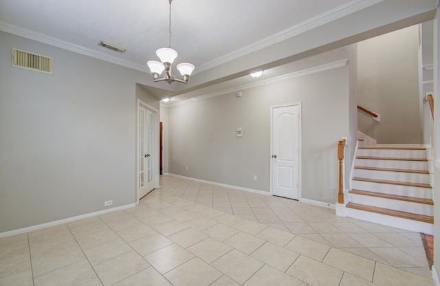 tiled spare room with crown molding and an inviting chandelier