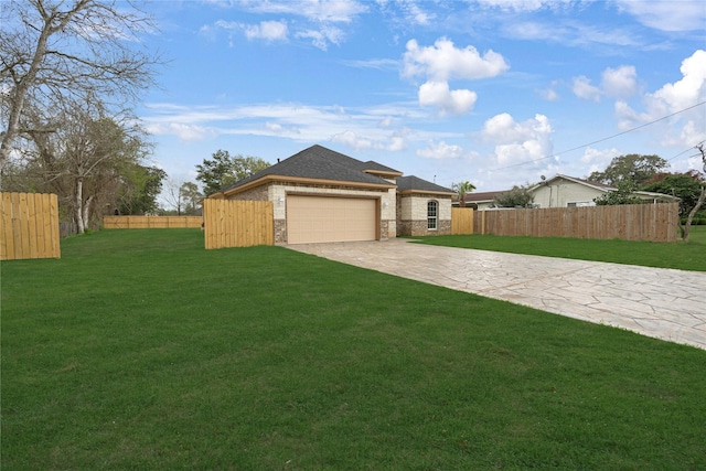 view of front facade with a garage and a front lawn