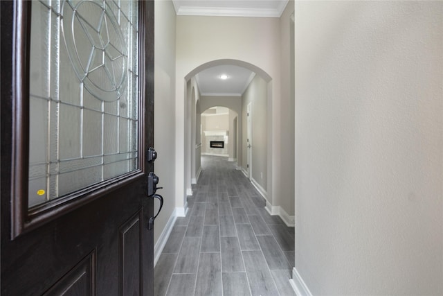 entrance foyer featuring light hardwood / wood-style floors and ornamental molding