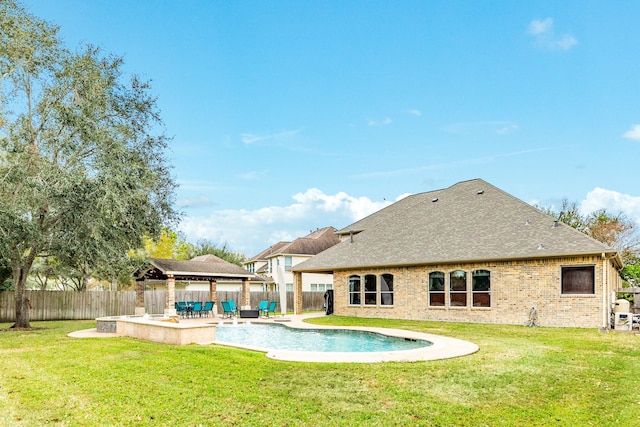 view of swimming pool with a yard and a patio