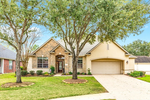 view of front of house with a garage and a front yard