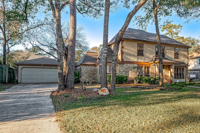 view of front of property with a front yard and a garage