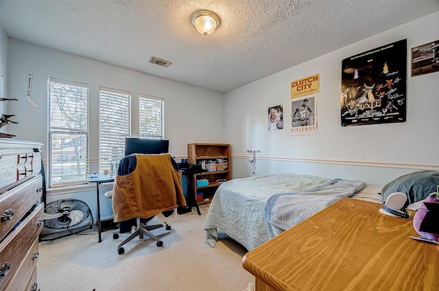 bedroom featuring a textured ceiling