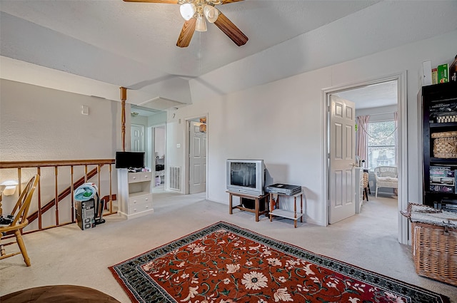 sitting room featuring carpet flooring, ceiling fan, and vaulted ceiling