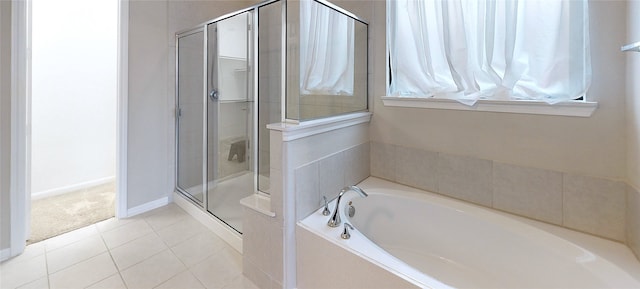 bathroom with tile patterned flooring and plus walk in shower