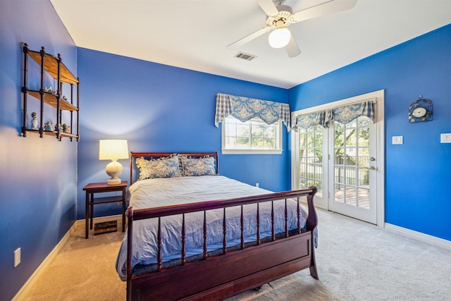 bedroom with access to exterior, ceiling fan, and carpet