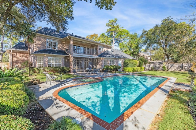 view of pool with an in ground hot tub and a patio