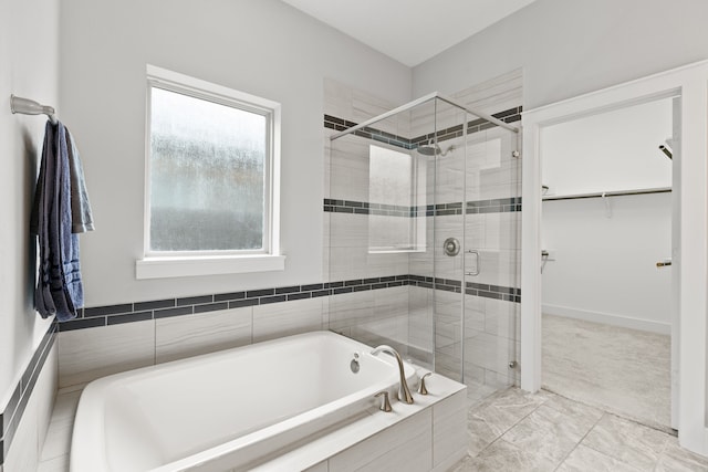 bathroom featuring plus walk in shower