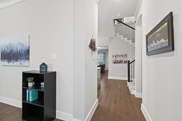 hall with crown molding and dark wood-type flooring