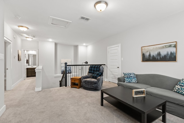 living room featuring light carpet