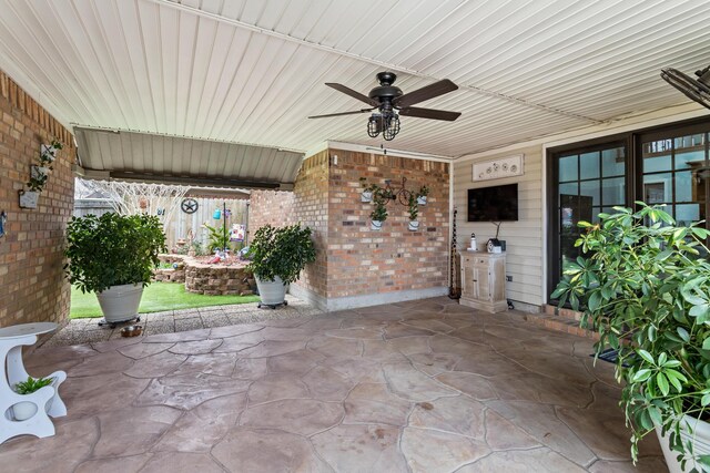 view of patio featuring ceiling fan