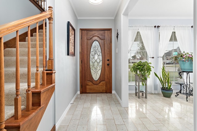 entrance foyer featuring ornamental molding