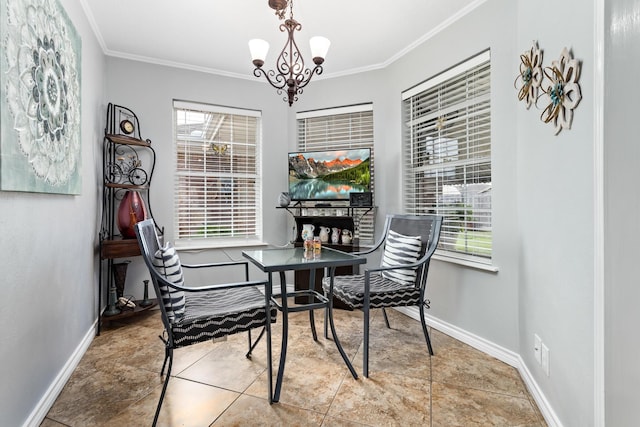 tiled dining space with a healthy amount of sunlight, ornamental molding, and an inviting chandelier