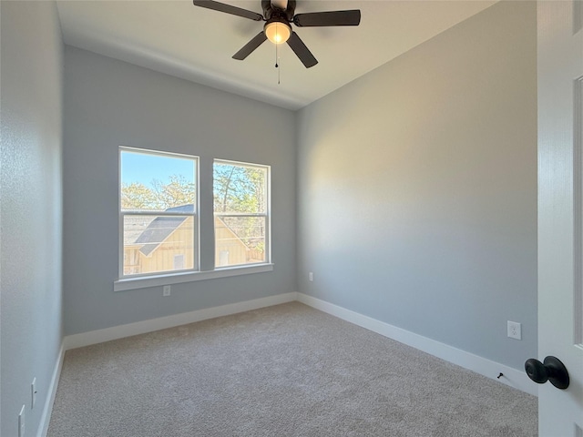 spare room featuring ceiling fan and carpet flooring