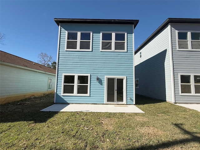 rear view of property with a yard