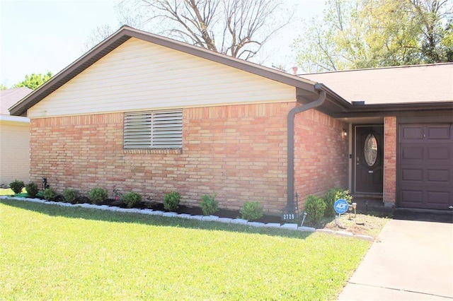 view of front facade with a front yard and a garage