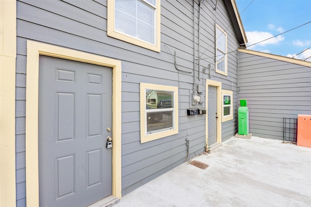 property entrance with a patio