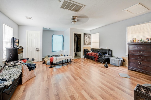 bedroom with ceiling fan and light wood-type flooring