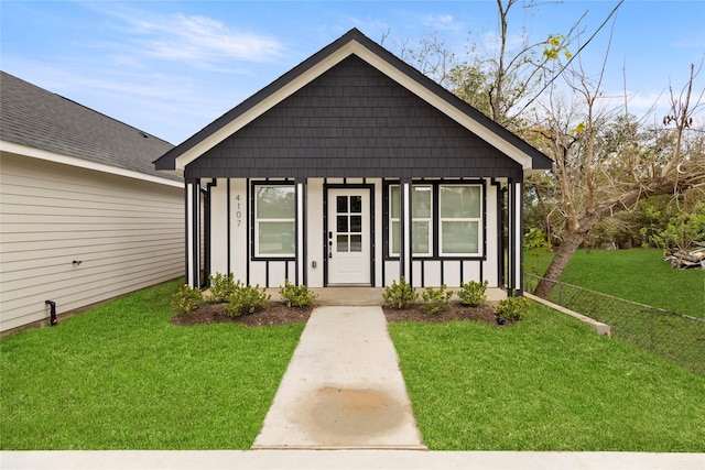 bungalow with a front lawn