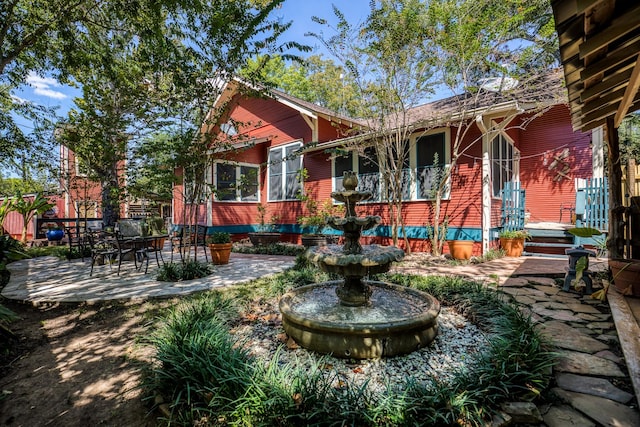 rear view of property featuring a patio