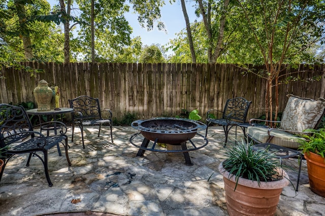 view of patio with a fire pit