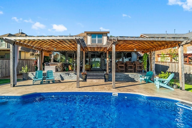 rear view of property with a fenced in pool, fence, a patio, and a pergola