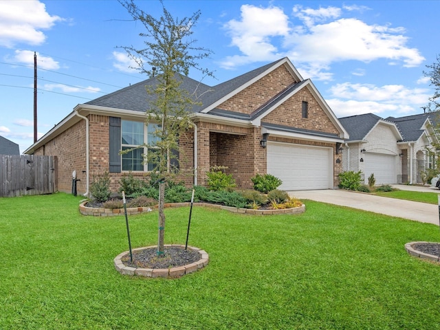 view of front of house featuring a garage and a front lawn