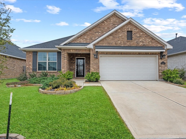 view of front of house with a garage and a front yard