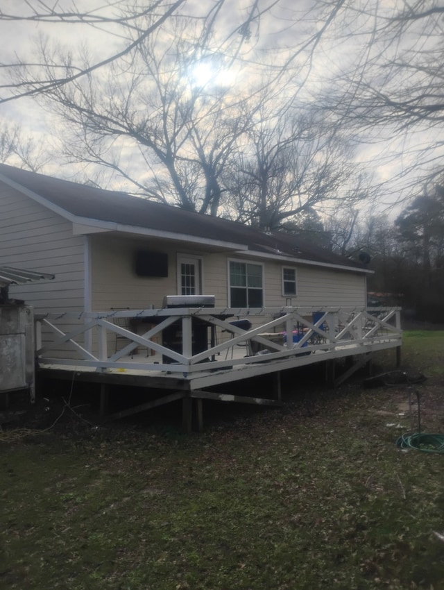 rear view of property with a deck