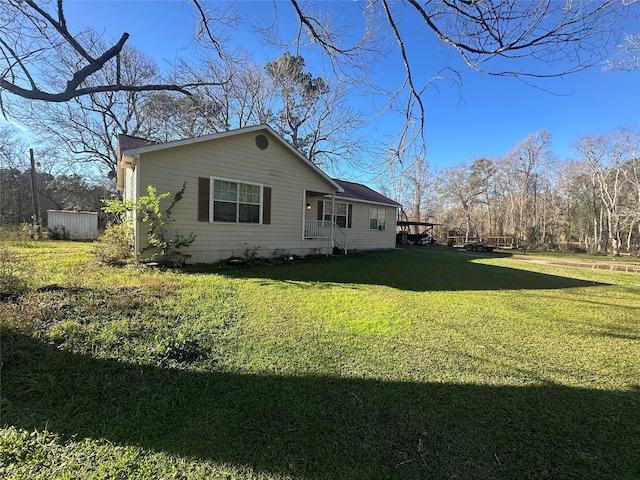 view of property exterior with a lawn